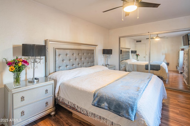 bedroom featuring ceiling fan and dark hardwood / wood-style floors