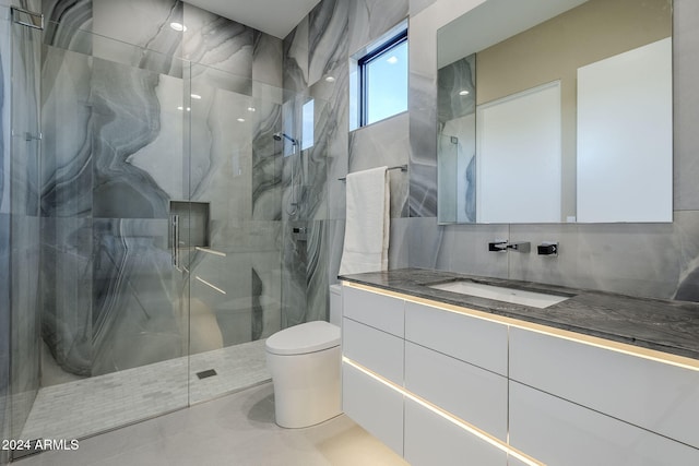 bathroom featuring walk in shower, toilet, decorative backsplash, vanity, and tile walls