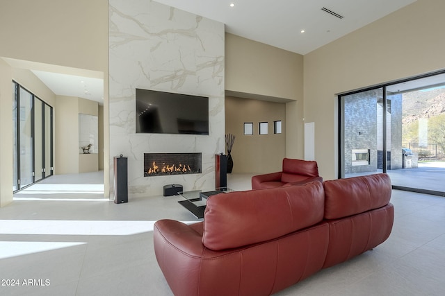 tiled living room with a premium fireplace