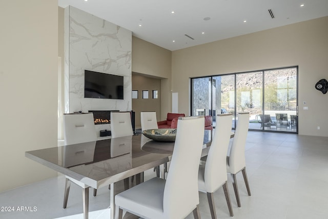 dining space with a high end fireplace