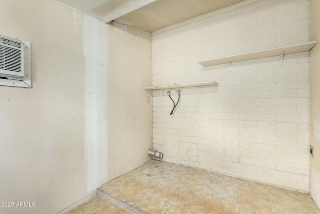 basement featuring a wall unit AC