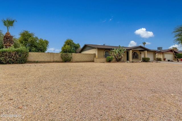 ranch-style home featuring a garage