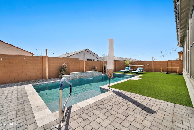 view of pool with a patio, a lawn, a fenced backyard, and a fenced in pool