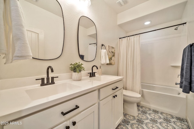 full bath with visible vents, a sink, toilet, and tile patterned floors