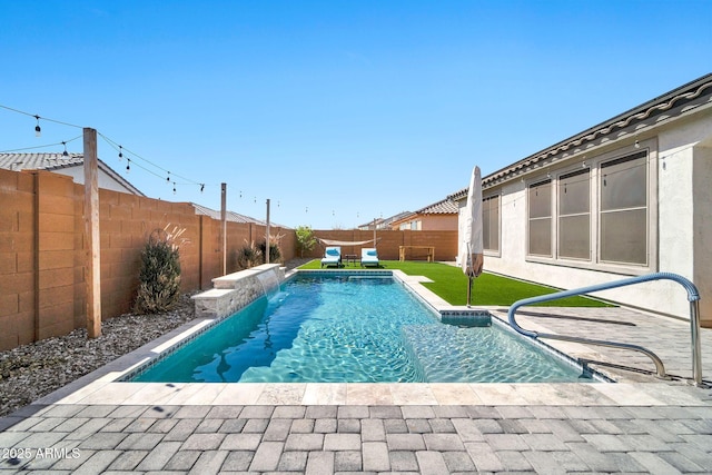 view of pool featuring a lawn, a patio area, a fenced backyard, and a fenced in pool