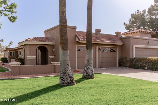 view of front facade featuring driveway, a garage, a tiled roof, a front yard, and stucco siding