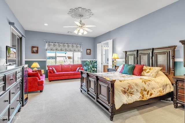 bedroom with recessed lighting, visible vents, light carpet, and ceiling fan