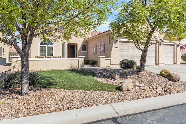 view of front facade featuring an attached garage, a tiled roof, central AC unit, stucco siding, and driveway