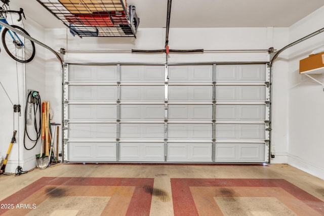 garage featuring baseboards