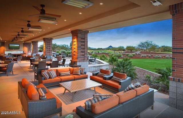 view of patio featuring outdoor dining space, an outdoor living space, and ceiling fan