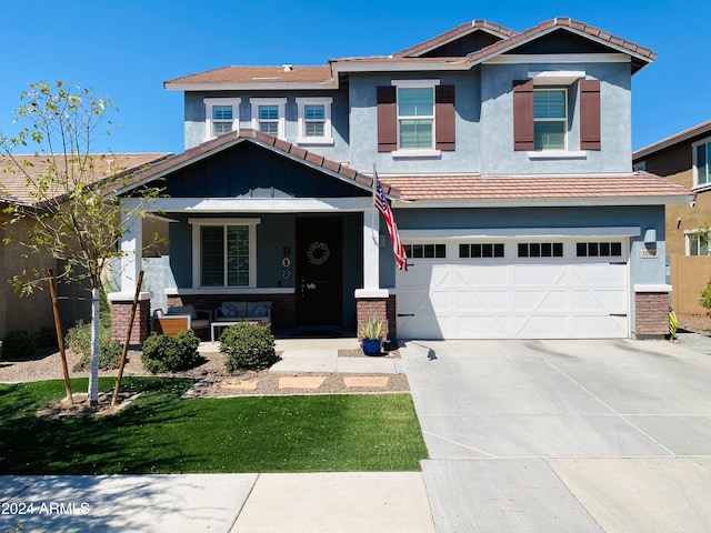 craftsman-style home with a garage and a porch