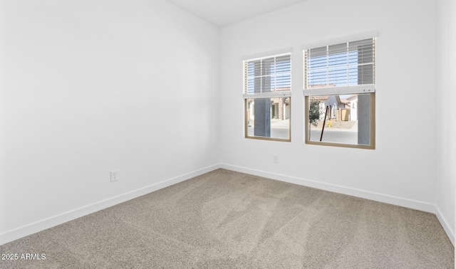 unfurnished room with carpet flooring