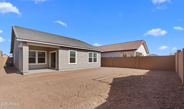 back of house featuring a patio area and central AC