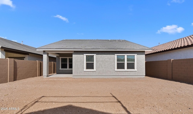 back of house with a patio