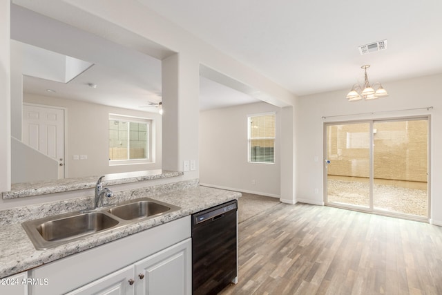 kitchen featuring dishwasher, a healthy amount of sunlight, sink, and light hardwood / wood-style floors