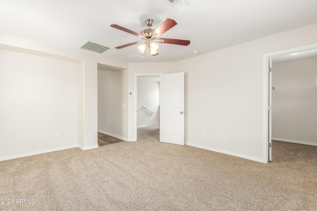 915 E Agua Fria Ln, Avondale, AZ 85323 - unfurnished bedroom featuring a closet, carpet flooring, visible vents, and a walk in closet