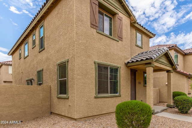 915 E Agua Fria Ln, Avondale, AZ 85323 - exterior space featuring fence, stucco siding, and a tiled roof