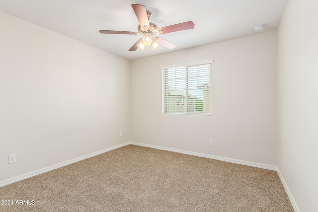 empty room with carpet and ceiling fan