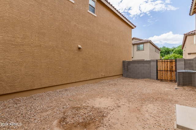 view of side of home featuring central AC