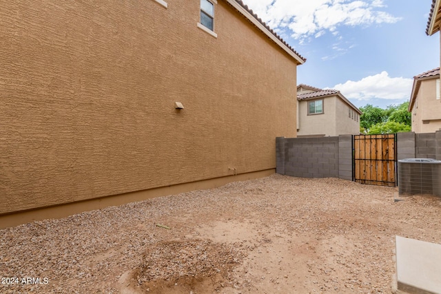915 E Agua Fria Ln, Avondale, AZ 85323 - view of yard featuring central AC unit, a gate, and fence