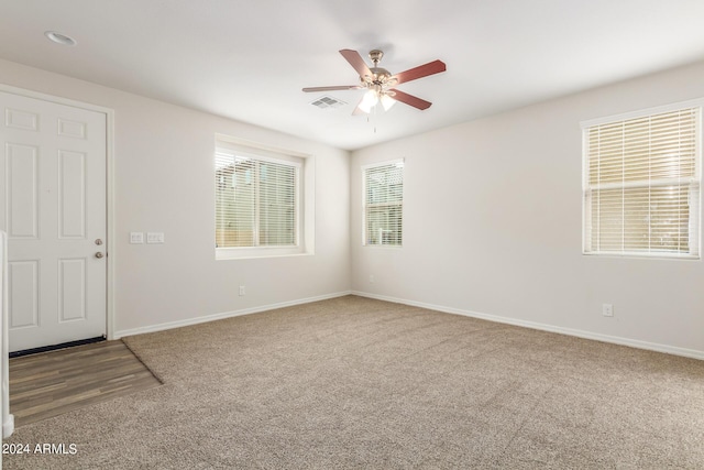 915 E Agua Fria Ln, Avondale, AZ 85323 - spare room featuring baseboards, carpet floors, visible vents, and a ceiling fan