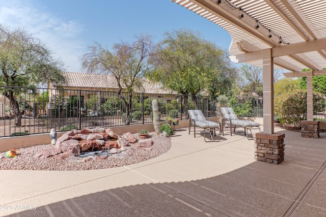 view of patio / terrace with fence and a pergola