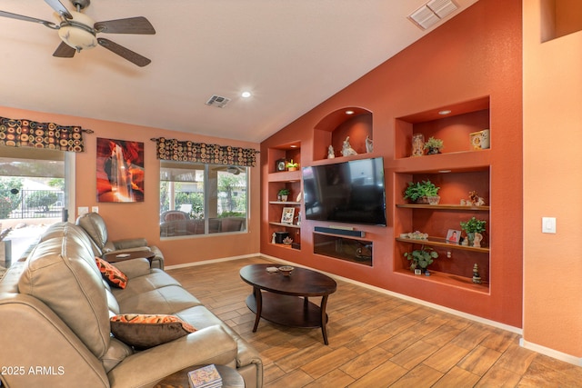 living area with a wealth of natural light, visible vents, and built in features