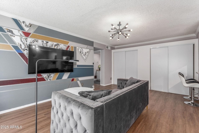 3500 N Hayden Rd Unit 801, Scottsdale, AZ 85251 - living room with wood finished floors, a textured ceiling, ornamental molding, and a chandelier