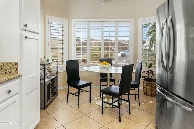 dining space with light tile patterned floors