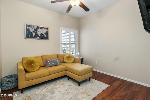 living room featuring ceiling fan and hardwood / wood-style flooring