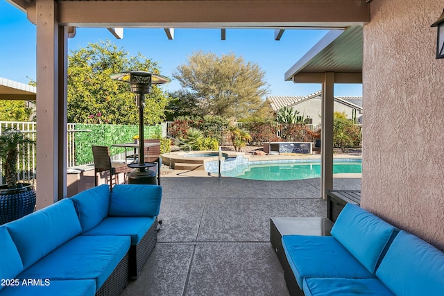 view of patio / terrace featuring a swimming pool with hot tub and an outdoor living space