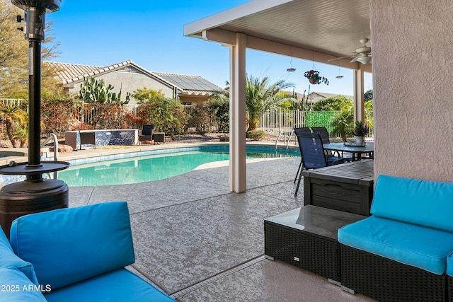 view of pool featuring a patio area and ceiling fan