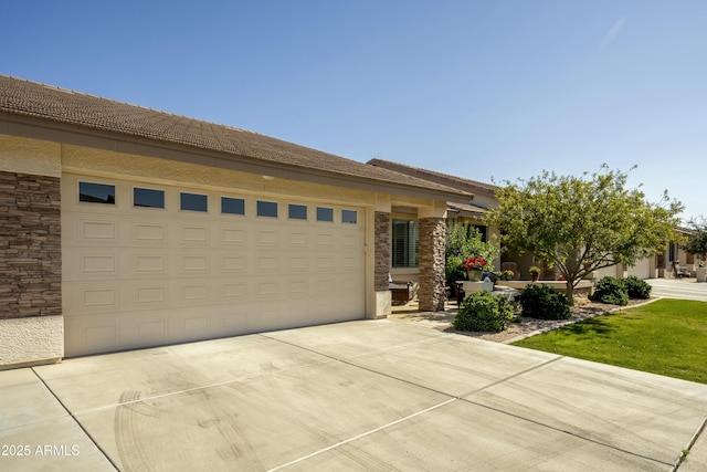 view of front of home with an attached garage and concrete driveway