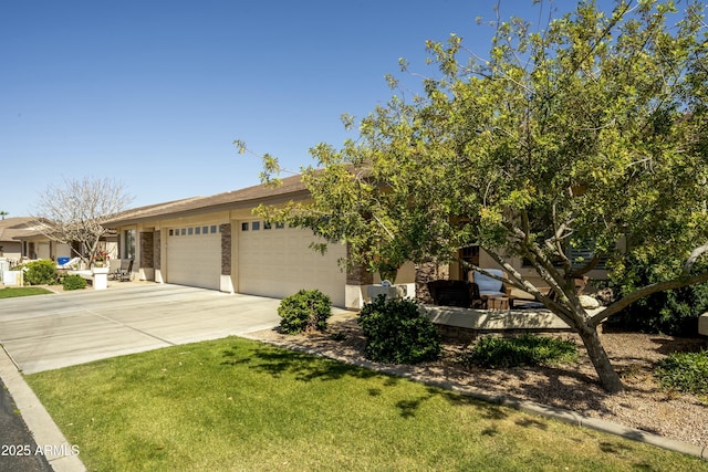 view of front facade with concrete driveway, a garage, and a front yard