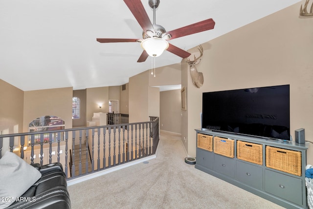 living room with light colored carpet, vaulted ceiling, and ceiling fan