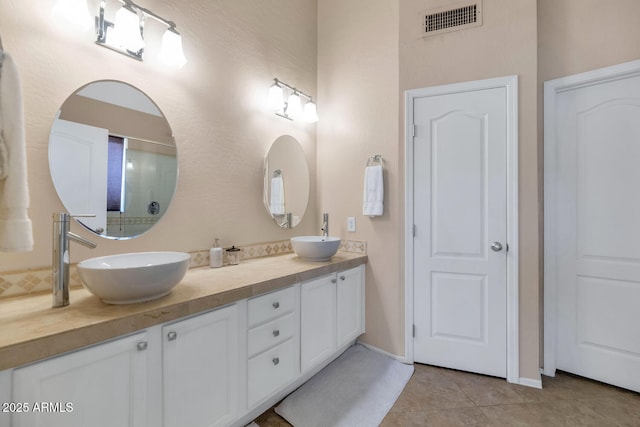 bathroom with vanity and tile patterned floors