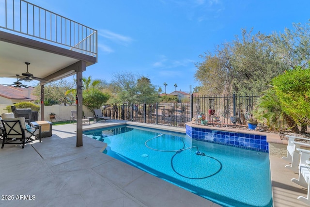 view of swimming pool featuring a patio area and ceiling fan