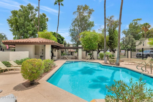 view of swimming pool featuring a patio area