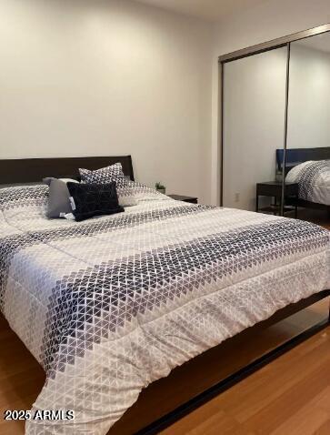 1850 E Maryland Ave Unit 63, Phoenix, AZ 85016 - bedroom featuring wood finished floors and a closet