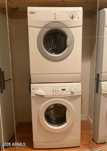 1850 E Maryland Ave Unit 63, Phoenix, AZ 85016 - washroom featuring stacked washer / dryer and light wood-style flooring