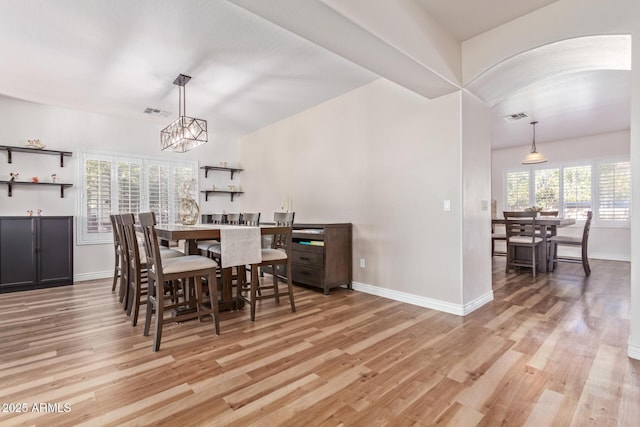 dining room featuring plenty of natural light and light hardwood / wood-style floors