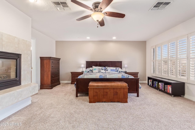 bedroom with light carpet and ceiling fan