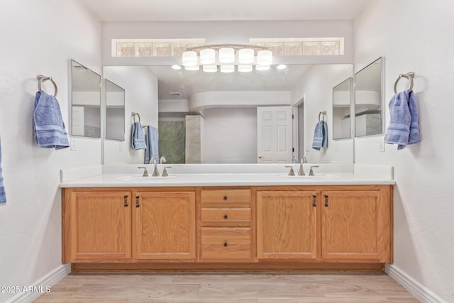 bathroom featuring hardwood / wood-style floors and vanity