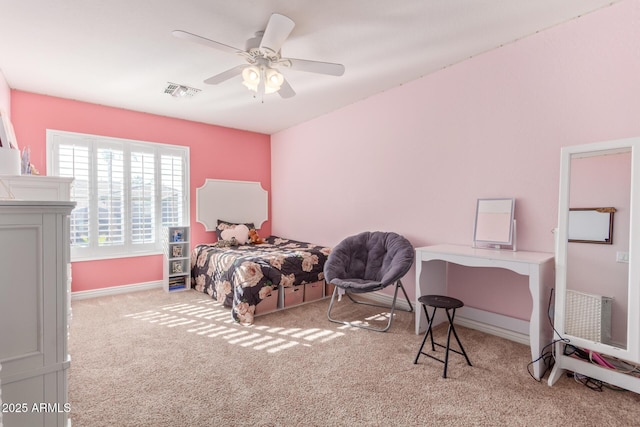 bedroom featuring ceiling fan and light carpet