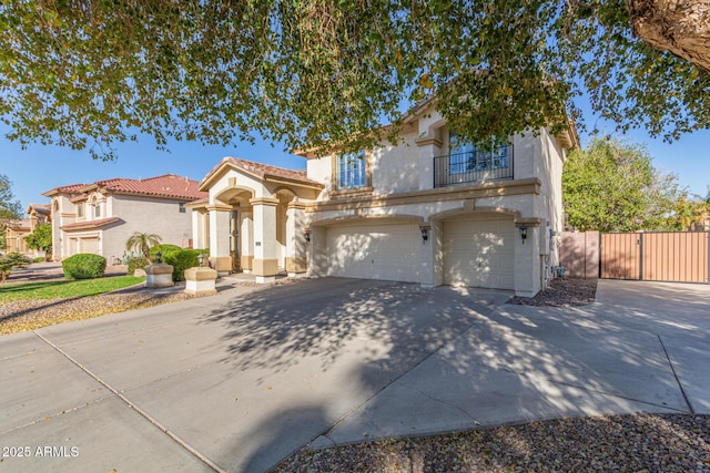 view of front of property with a garage and a balcony