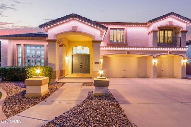 1684 E Coconino Dr, Chandler, AZ 85249 - mediterranean / spanish home with stucco siding, driveway, an attached garage, and a tile roof