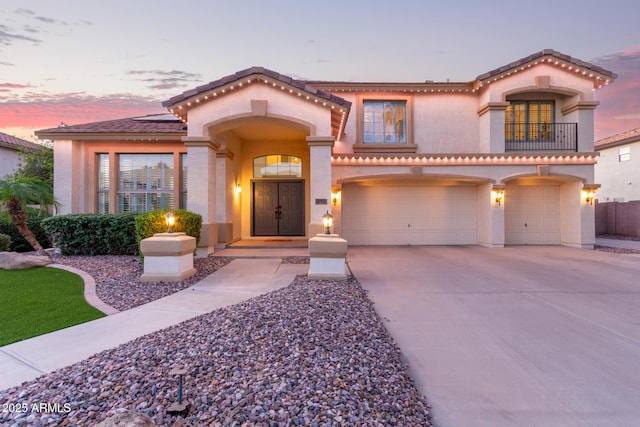 1684 E Coconino Dr, Chandler, AZ 85249 - mediterranean / spanish home with a garage, driveway, stucco siding, a balcony, and a tile roof