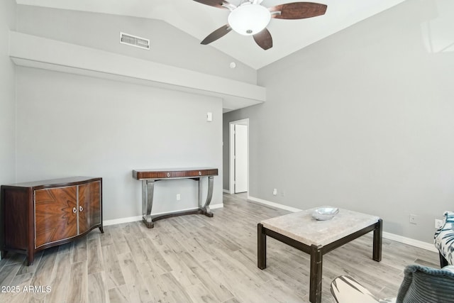 interior space featuring ceiling fan, lofted ceiling, and light wood-type flooring