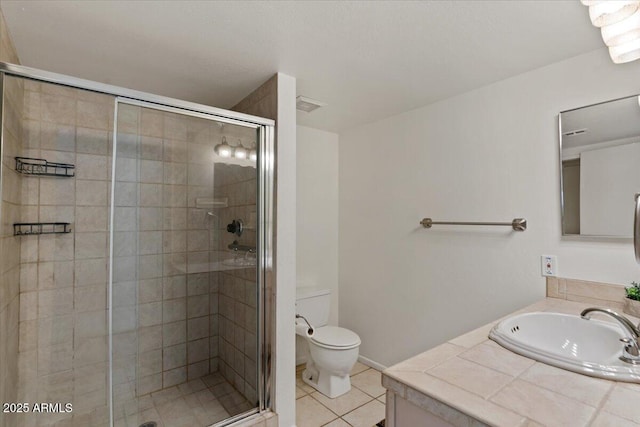 bathroom featuring vanity, visible vents, a stall shower, tile patterned flooring, and toilet