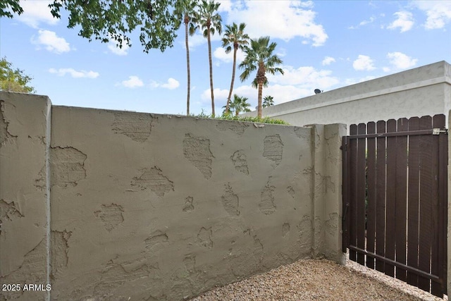 exterior space with fence and a gate